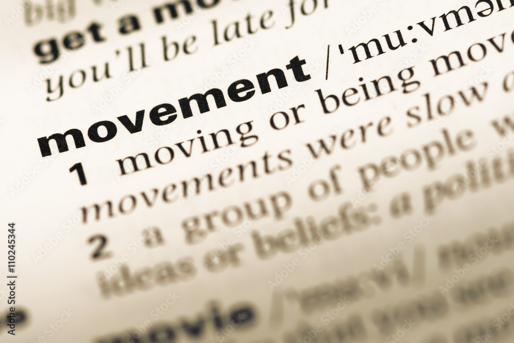 Close up of old English dictionary page with word movement Close up of old English dictionary page with word movement