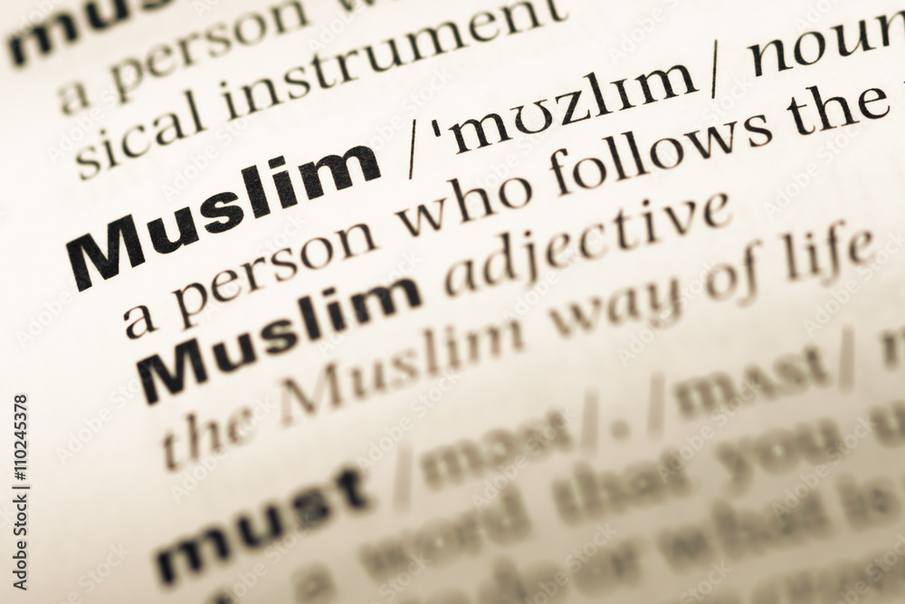 Close up of old English dictionary page with word muslim Close up of old English dictionary page with word muslim