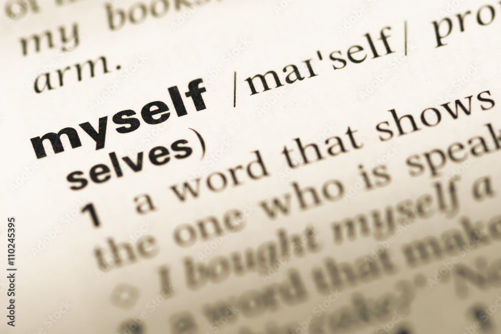 Close up of old English dictionary page with word myself Close up of old English dictionary page with word myself