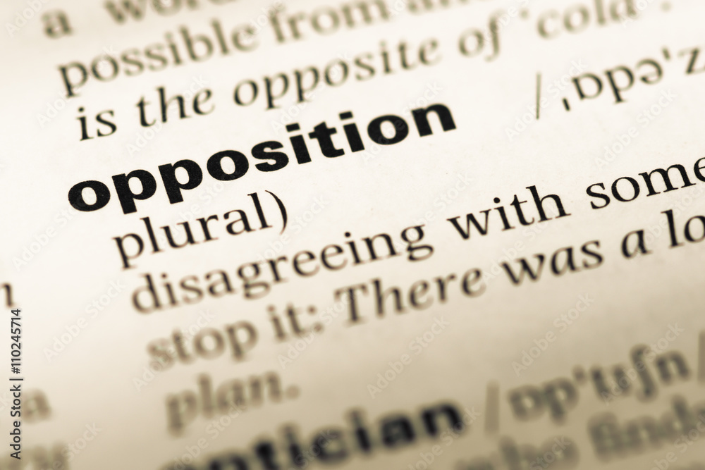 Close up of old English dictionary page with word opposition