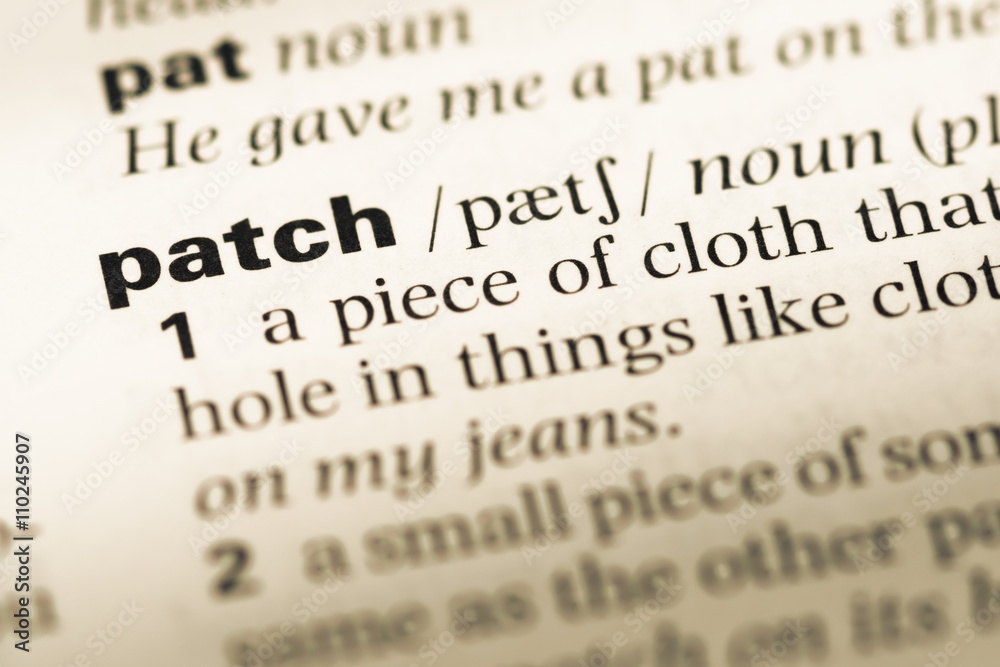 Close up of old English dictionary page with word patch Close up of old English dictionary page with word patch