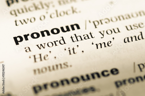 Close up of old English dictionary page with word pronoun photo