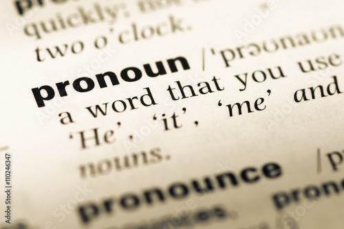 Close up of old English dictionary page with word pronoun