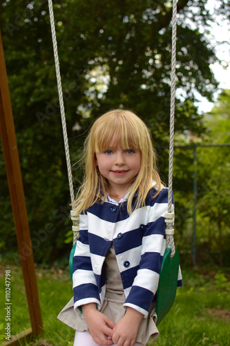 young girl on swing