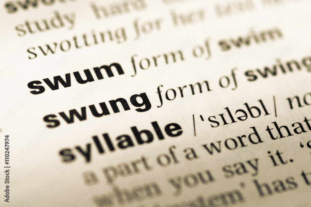 Close up of old English dictionary page with word swum Close up of old English dictionary page with word swum