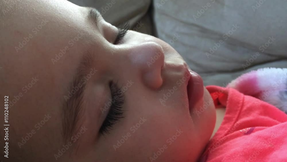Face of small child sleeping quietly and sound.
Face of small child sleeping quietly and sound.