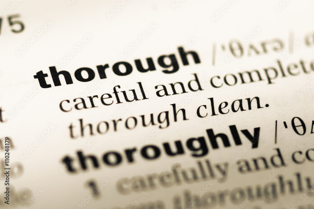 Obraz premium Close up of old English dictionary page with word thorough