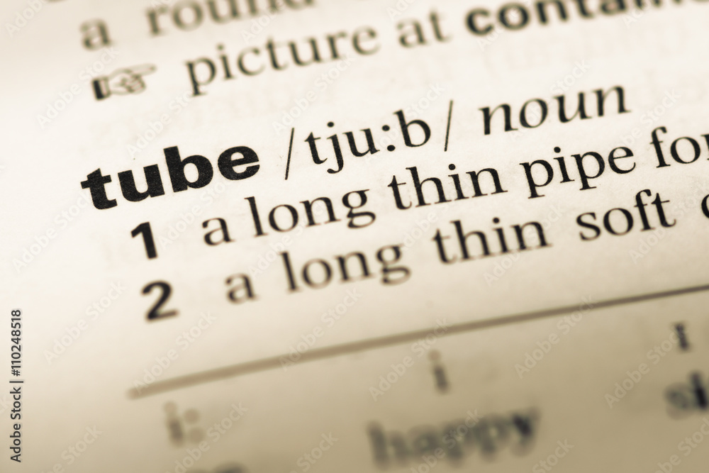 Close up of old English dictionary page with word tube Close up of old English dictionary page with word tube