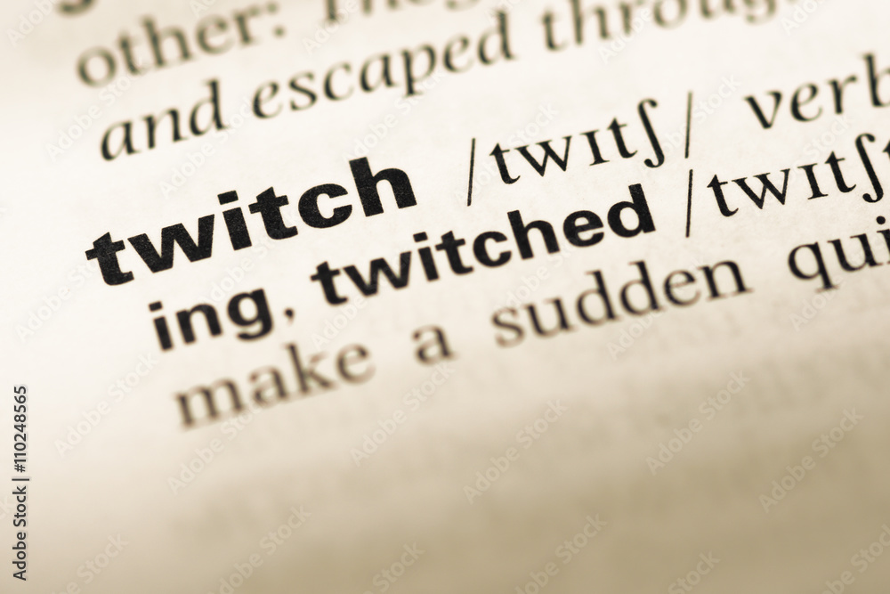 Close up of old English dictionary page with word twitch Close up of old English dictionary page with word twitch