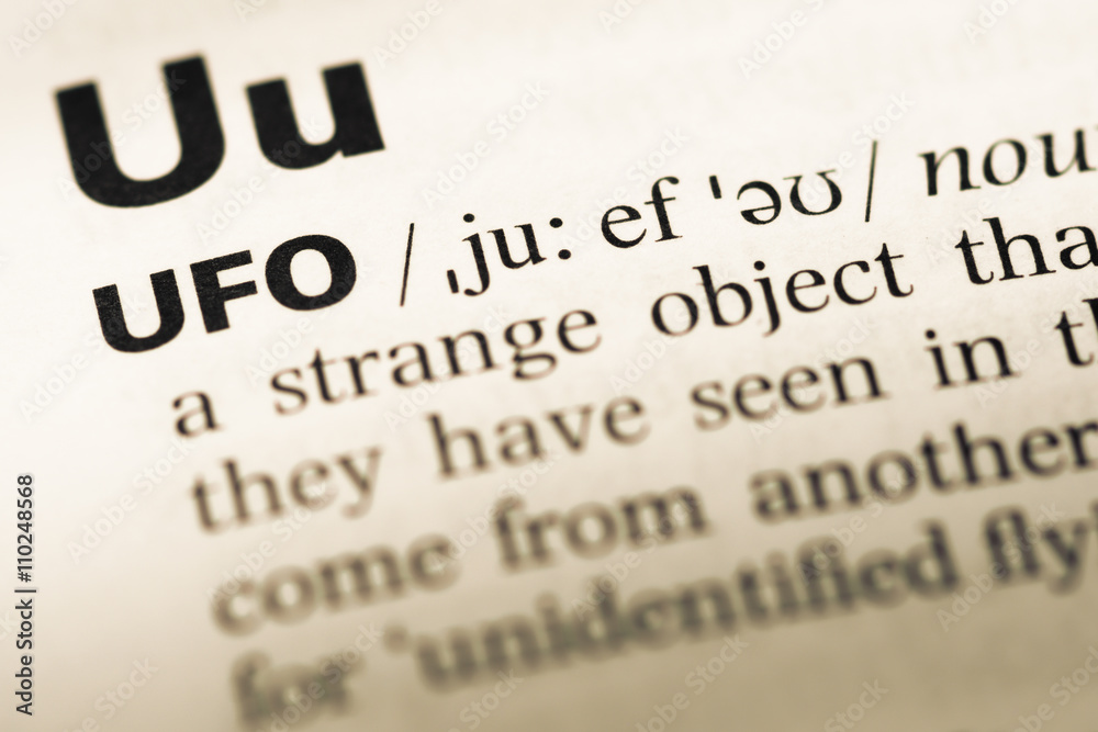 Obraz premium Close up of old English dictionary page with word ufo