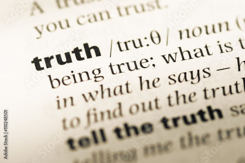 Close up of old English dictionary page with word truth
