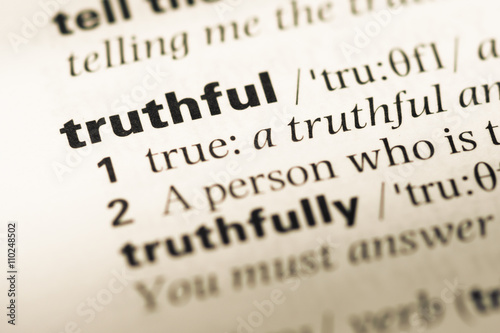 Close up of old English dictionary page with word truthful