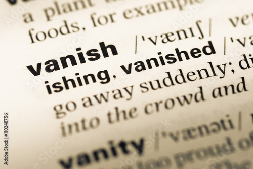Close up of old English dictionary page with word vanish