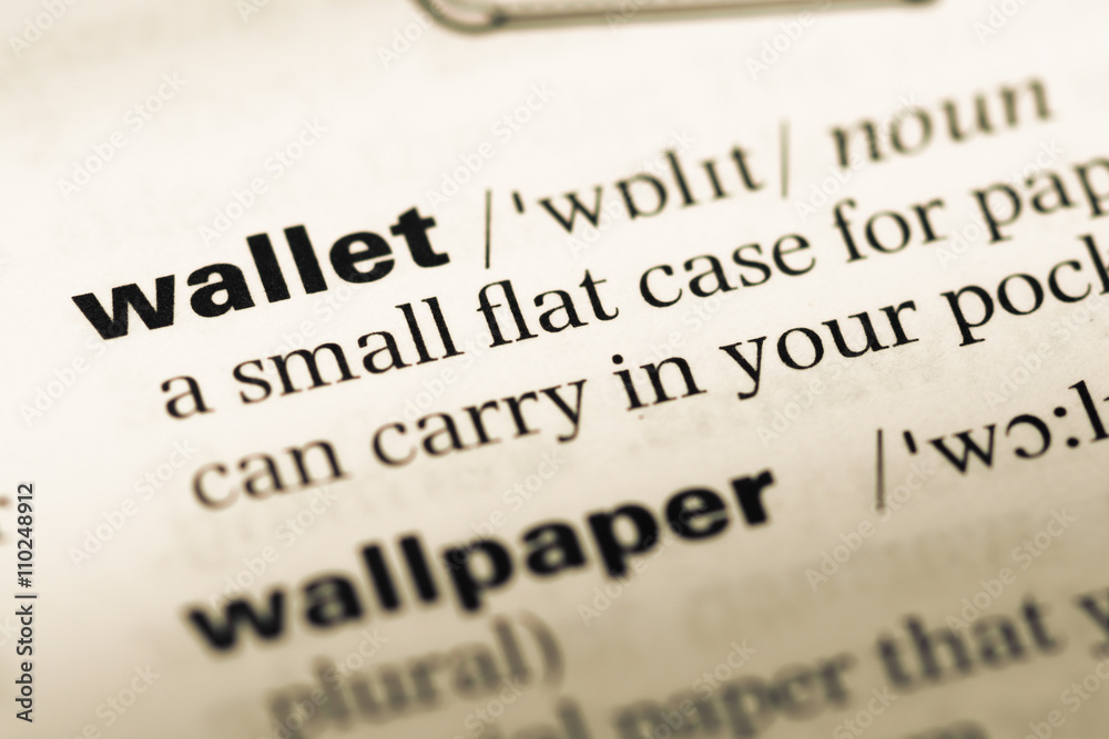 Obraz premium Close up of old English dictionary page with word wallet