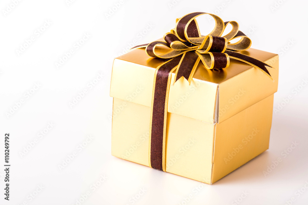Golden gift box isolated on white background Golden gift box isolated on white background