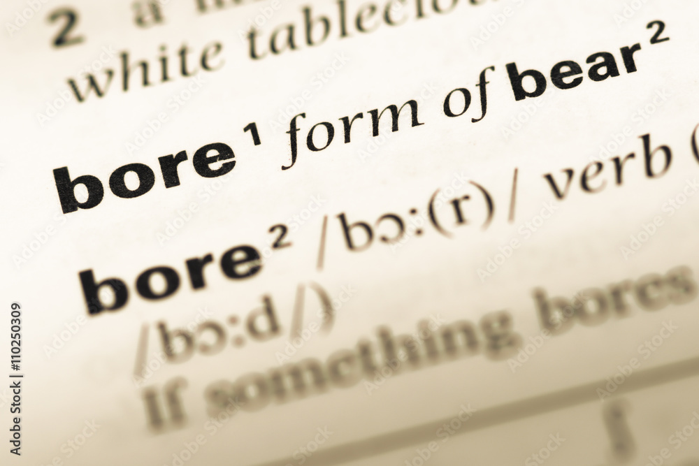 Close up of old English dictionary page with word bore Close up of old English dictionary page with word bore