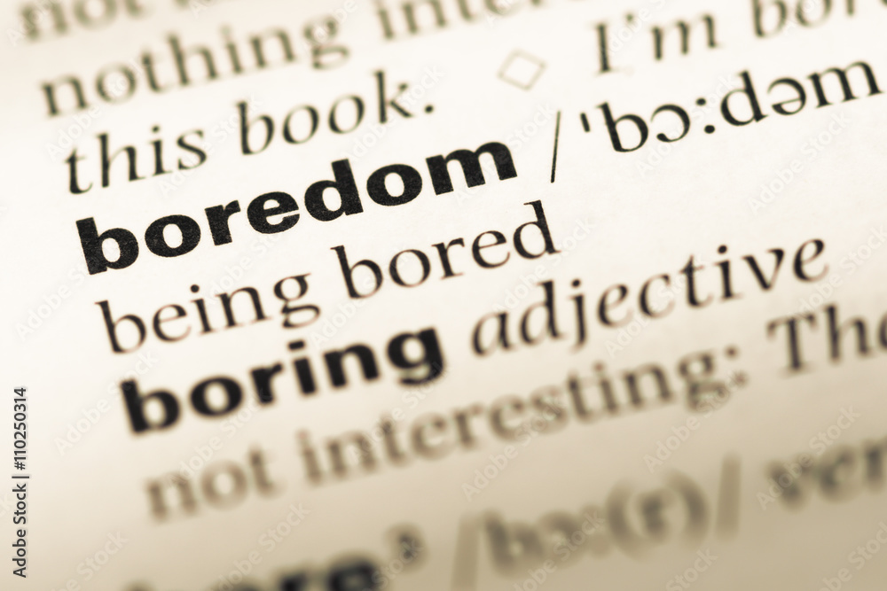 Close up of old English dictionary page with word boredom Close up of old English dictionary page with word boredom