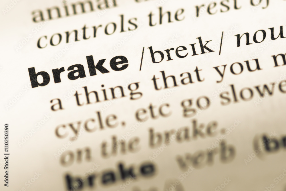Obraz premium Close up of old English dictionary page with word brake