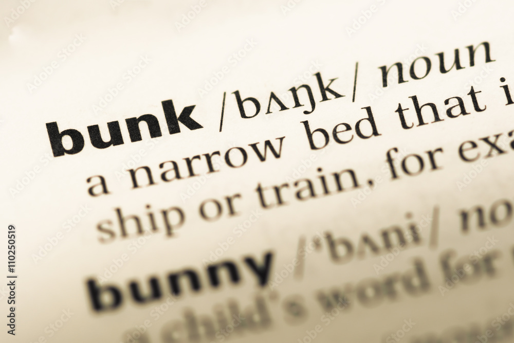 Fototapeta premium Close up of old English dictionary page with word bunk