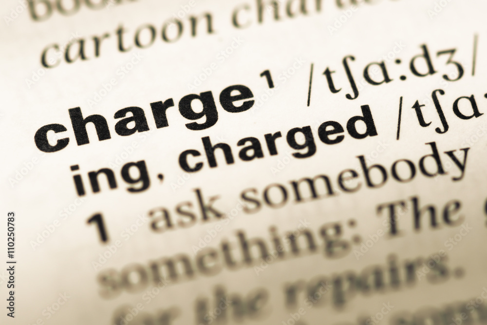 Close up of old English dictionary page with word charge Close up of old English dictionary page with word charge