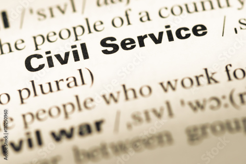 Close up of old English dictionary page with word civil service