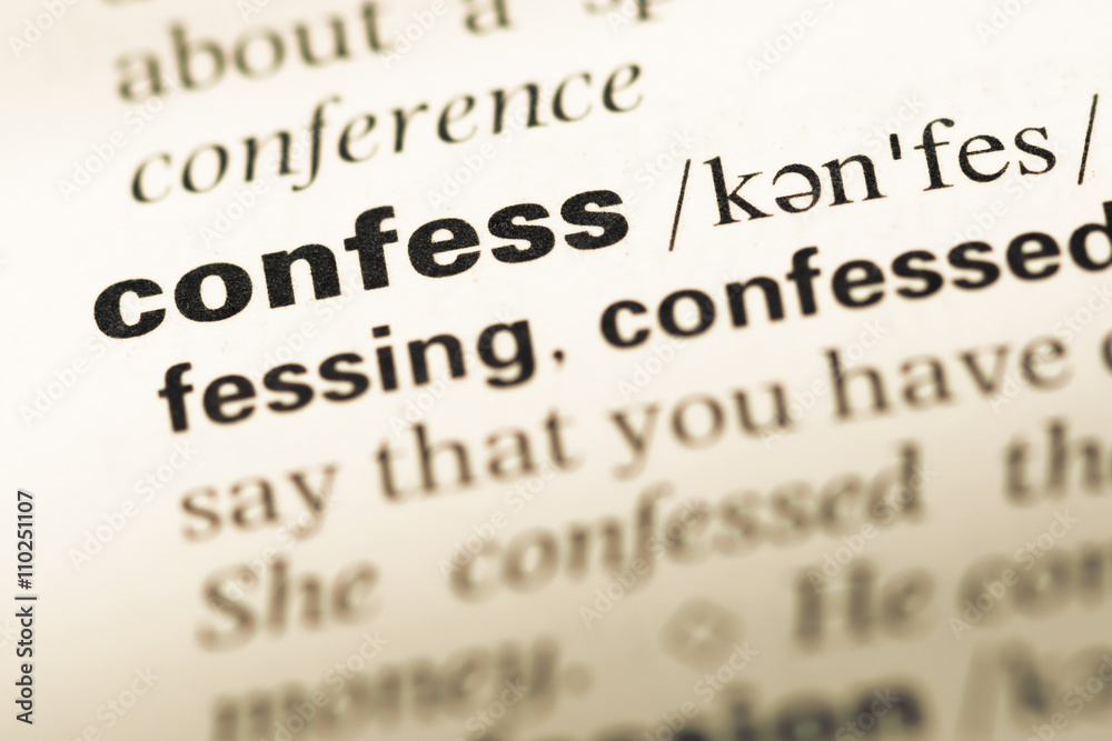 Close up of old English dictionary page with word confess Close up of old English dictionary page with word confess