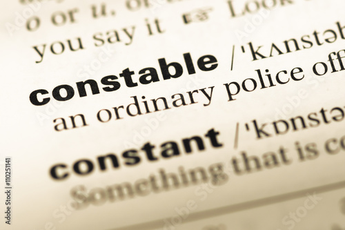 Close up of old English dictionary page with word constable