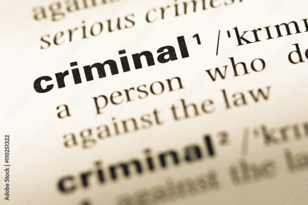 Close up of old English dictionary page with word criminal Close up of old English dictionary page with word criminal