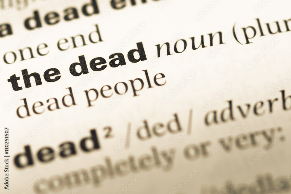 Close up of old English dictionary page with word the dead Close up of old English dictionary page with word the dead