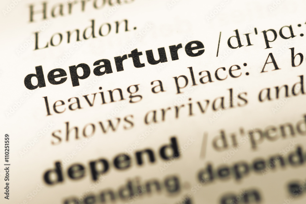 Close up of old English dictionary page with word departure Close up of old English dictionary page with word departure
