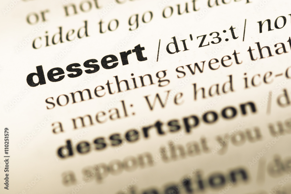 Obraz premium Close up of old English dictionary page with word dessert