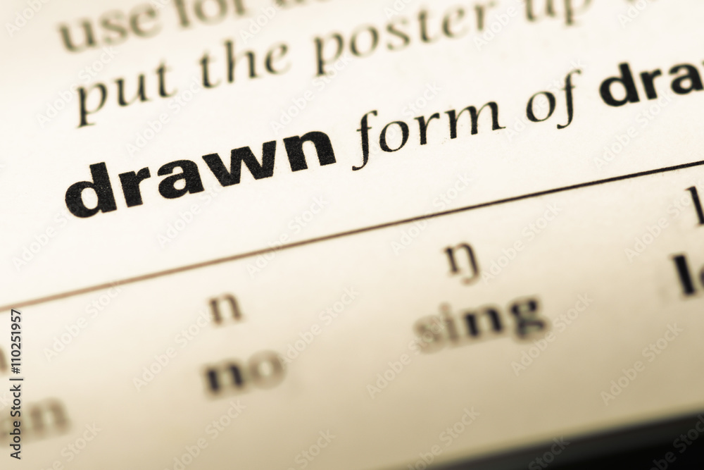 Close up of old English dictionary page with word drawn Close up of old English dictionary page with word drawn