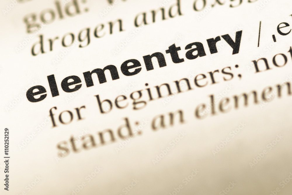 Close up of old English dictionary page with word elementary Close up of old English dictionary page with word elementary