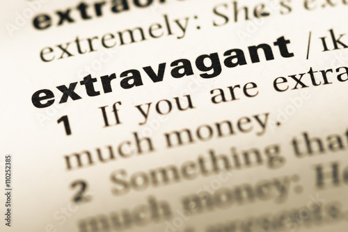 Close up of old English dictionary page with word extravagant