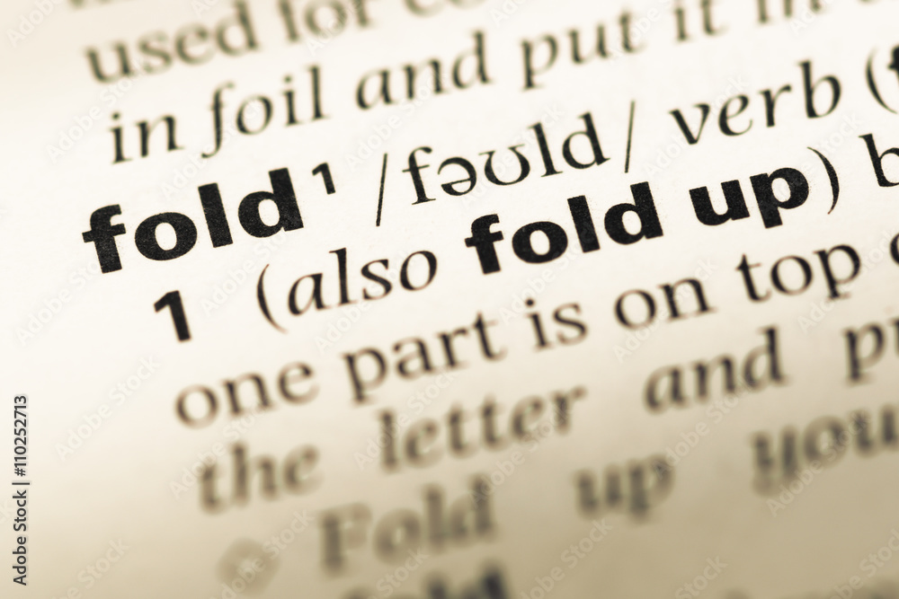 Obraz premium Close up of old English dictionary page with word fold