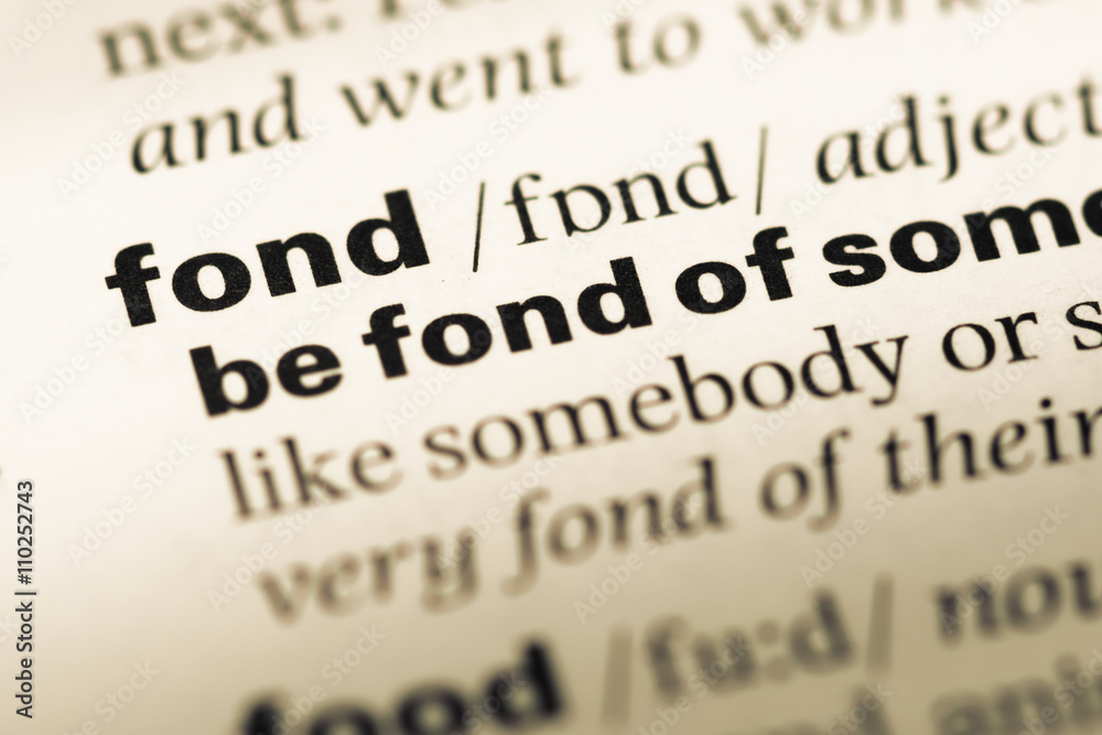 Close up of old English dictionary page with word fond Close up of old English dictionary page with word fond
