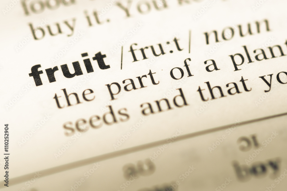 Close up of old English dictionary page with word fruit Close up of old English dictionary page with word fruit