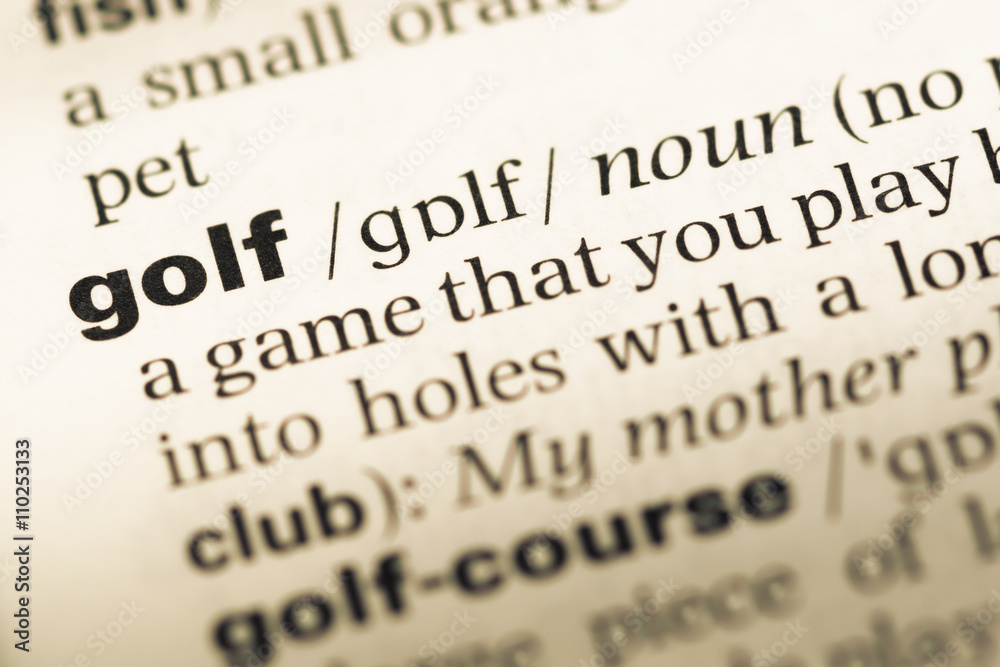 Obraz premium Close up of old English dictionary page with word golf