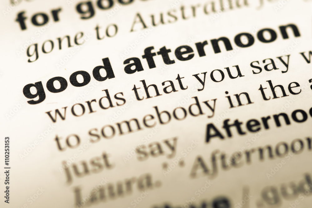 Close up of old English dictionary page with word good afternoon Close up of old English dictionary page with word good afternoon