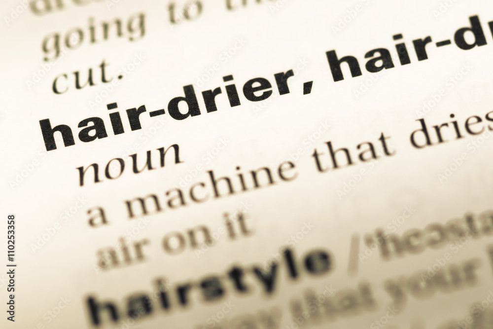 Close up of old English dictionary page with word hair drier