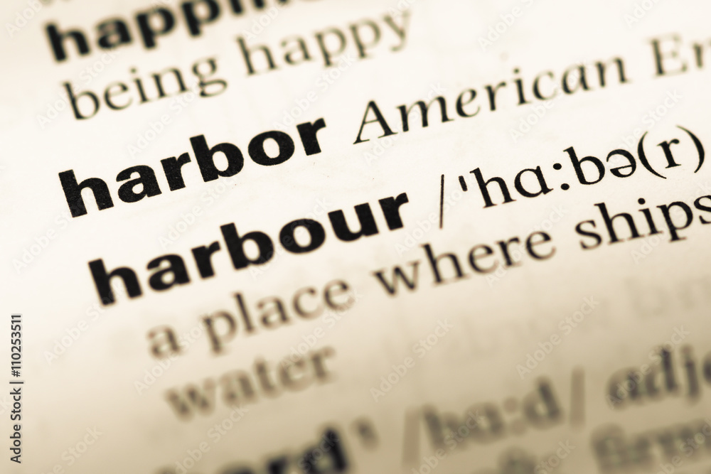 Close up of old English dictionary page with word harbor Close up of old English dictionary page with word harbor