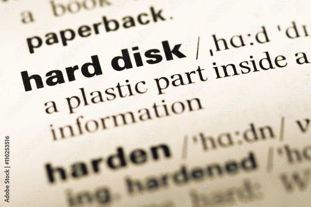 Close up of old English dictionary page with word hard disk Close up of old English dictionary page with word hard disk