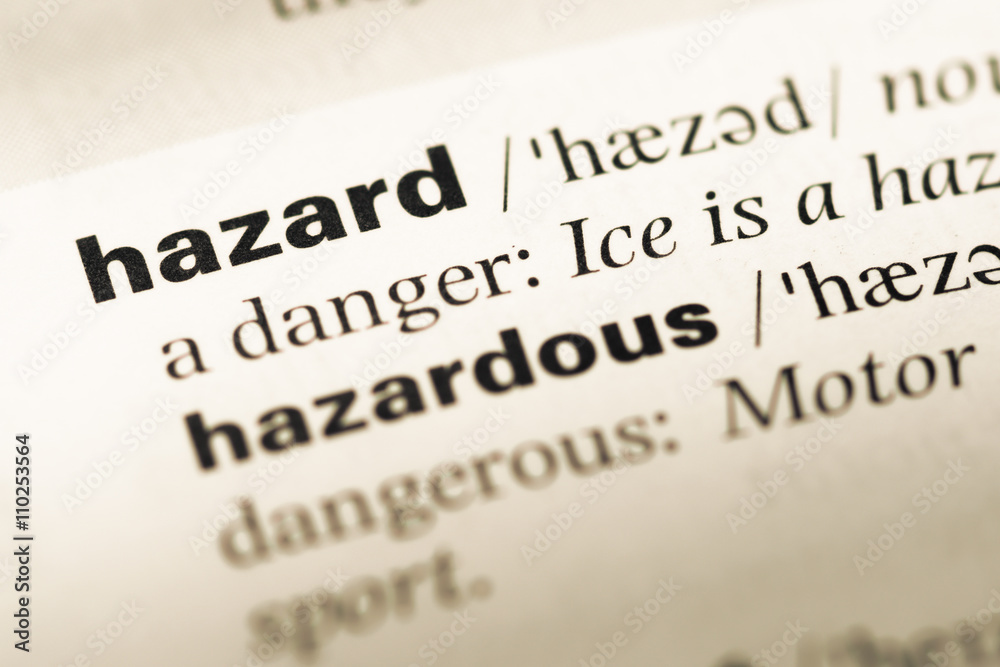 Close up of old English dictionary page with word hazard Close up of old English dictionary page with word hazard