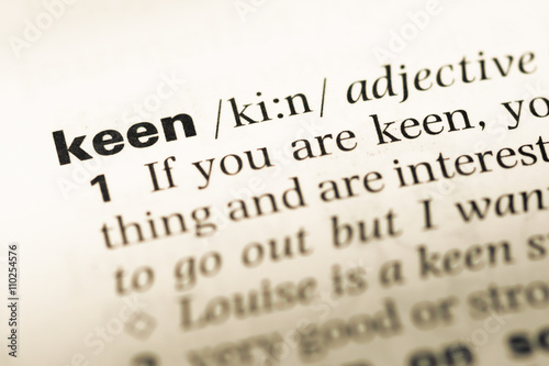 Close up of old English dictionary page with word keen