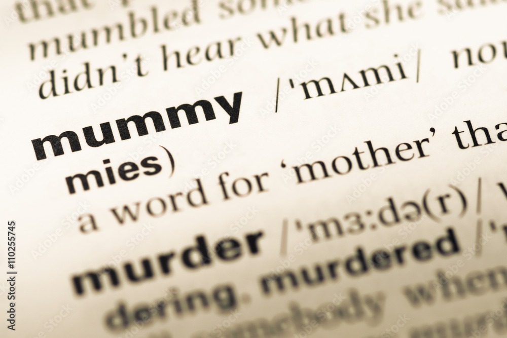 Close up of old English dictionary page with word mummy Close up of old English dictionary page with word mummy