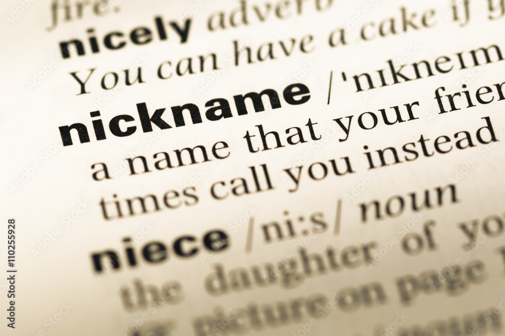 Close up of old English dictionary page with word nickname Close up of old English dictionary page with word nickname