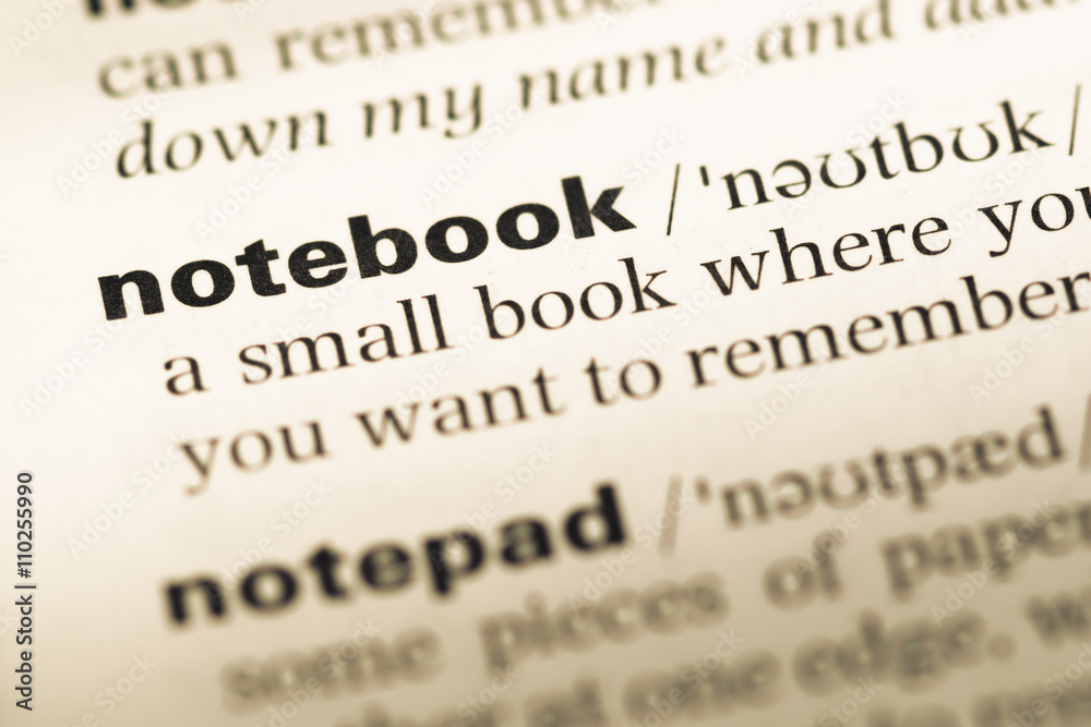 Close up of old English dictionary page with word notebook Close up of old English dictionary page with word notebook