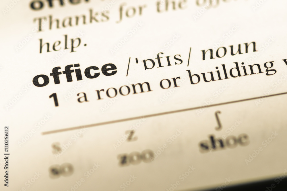 Close up of old English dictionary page with word office