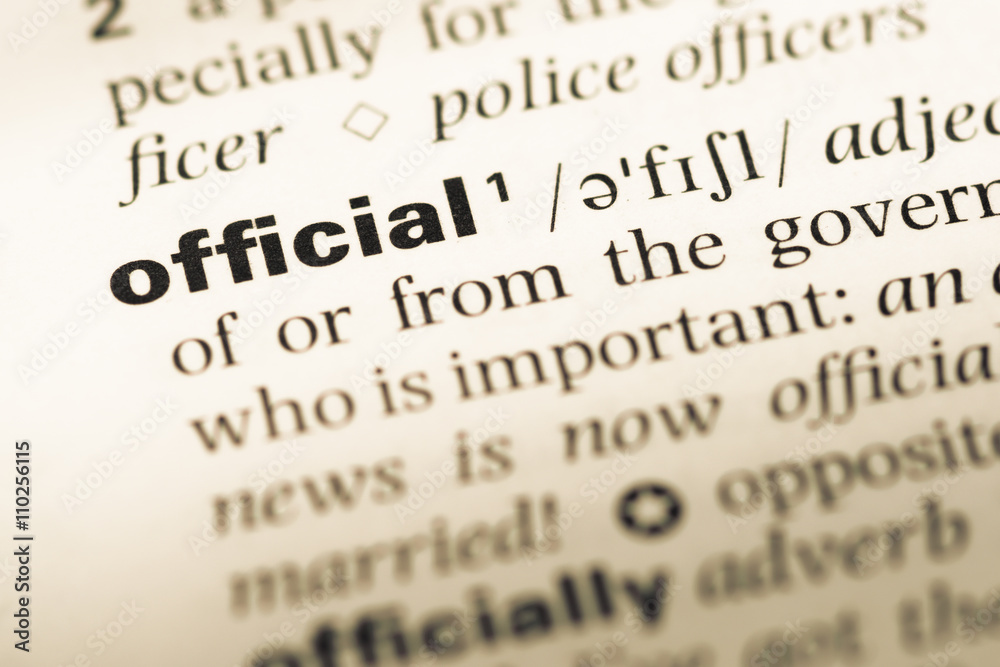 Close up of old English dictionary page with word official Close up of old English dictionary page with word official