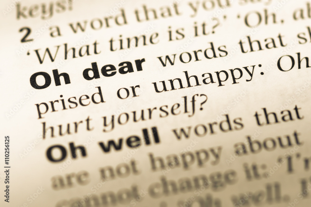 Close up of old English dictionary page with word oh dear Close up of old English dictionary page with word oh dear